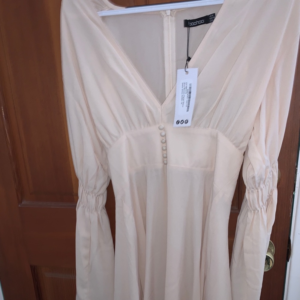 Ivory colored dress with flared sleeve